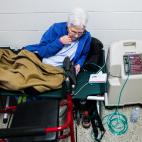 A woman attached to a respiratory machine is seen in a shelter run by Red Cross before Hurricane Florence comes ashore in Grantsboro, North Carolina, U.S., September 13, 2018. REUTERS/Eduardo Munoz