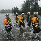 FAIRFIELD HARBOUR, NC - SEPTEMBER 14: Members of the FEMA Urban Search and Rescue Task Force 4 from Oakland, California, search a flooded neighborhood for evacuees during Hurricane Florence September 14, 2018 in Fairfield Harbour, North Carolin...