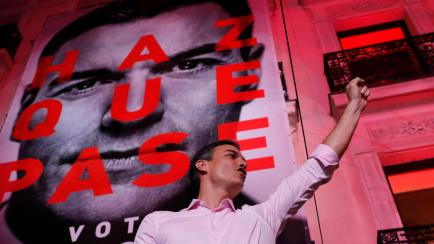 Spain's Prime Minister and Socialist Party leader Pedro Sanchez gestures to supporters outside the party headquarters following the general election in Madrid, Spain, Sunday, April 28, 2019. A divided Spain voted Sunday in its third general ...