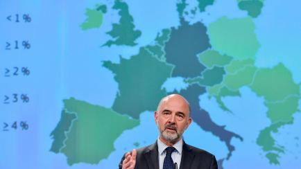 European Commissioner for Economic and Financial Affairs, Taxation and Customs Pierre Moscovici gestures as he speaks during a press conference at the European Commission headquarters in Brussels on May 7, 2019. (Photo by Eric Vidal / AFP)      ...