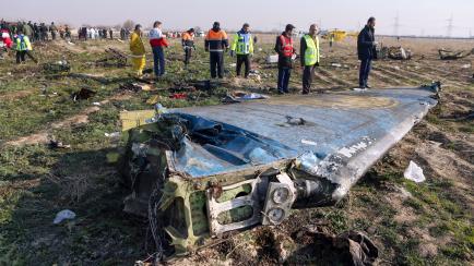 Rescue teams are seen on January 8, 2020 at the scene of a Ukrainian airliner that crashed shortly after take-off near Imam Khomeini airport in the Iranian capital Tehran. - Search-and-rescue teams were combing through the smoking wreckage of th...