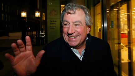 British comedian Terry Jones smiles as he leaves The Rolls Building in central London November 30, 2012. Three members of the Monty Python British comedy troupe were in court in London on Friday for the opening of a lawsuit over the profits from...