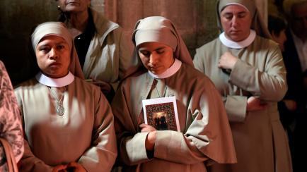 Three nuns attend a mass beatification of Antonio Gonzalez Alonso, Isidoro Fernandez Cordero, Genaro Fueyo Castanon y Segundo Alonso Gonzalez, known as the martyrs of Nembra, who were killed during the Spanish civil war, at Oviedo's cathedral, S...