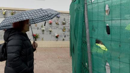 A relative during the removing the granite plates with the names of almost 3,000 killed by the Franco regime in the cemetery of La Almudena in Madrid on November 26th, 2019. (Photo by Juan Carlos Lucas/NurPhoto via Getty Images)