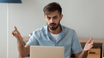 Shocked male worker look at laptop witnessing virus attack result in data loss, confused man using computer stare at screen seeing malfunction warning or notification, guy scared having pc breakdown