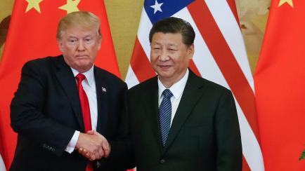 epa06316947 US President Donald J. Trump (L) and Chinese President Xi Jinping (R) shake hands during a press conference at the Great Hall of the People (GHOP) in Beijing, China, 09 November 2017. Trump is on an official visit to China from 08 to...