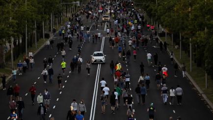 MADRID, SPAIN - MAY 11: People are seen at street as they walk, ride and run during the hours allowed by the government to exercise, amid the national lockdown to prevent the spread of the novel coronavirus (COVID-19) pandemic in Madrid, Spain o...