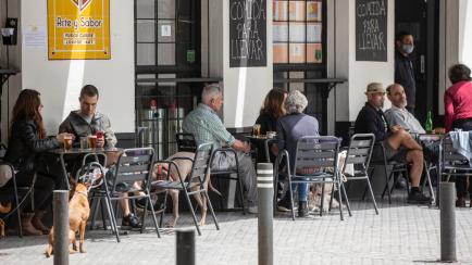 SEVILLE, SPAIN - MAY 12: People on the terrace of an open bar during the second day of phase 1 of the de-escalation plan drawn up by the Spanish Government on May 12, 2020 in Madrid, Spain. (Photo by María José López/Europa Press via Getty Images)