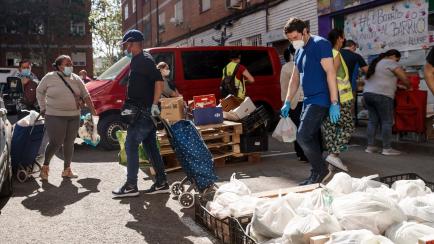 MADRID, SPAIN - MAY 23: (BILD ZEITUNG OUT) The Aluche neighborhood residents' association, made up of residents of the area, helps the most disadvantaged by distributing food on Quero street since the pandemic began. They started by helping 50 p...