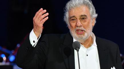 Spanish tenor Placido Domingo gestures as he performs during his concert in the newly inaugurated sports and culture centre 'St Gellert Forum' in Szeged, southern Hungary, on August 28, 2019. (Photo by Attila KISBENEDEK / AFP)        (Photo cred...