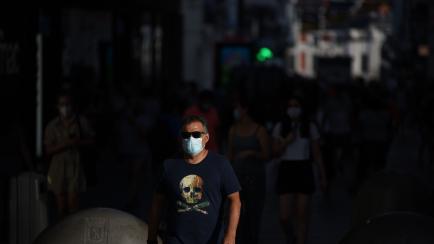 MADRID, SPAIN - 2020/07/20: A man walks along the street while wearing a face mask as a preventive measure against the spread of Coronavirus (COVID-19).
More and more Spanish regions have made face masks mandatory in all indoor and outdoor publi...