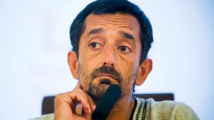 Doctor Pedro Cavadas listens during a press conference in La Fe hospital in Valencia, Spain, Tuesday, July 12, 2011. Doctors in Spain have carried out the world's first double leg transplant, giving new lower limbs to a young patient who lost th...