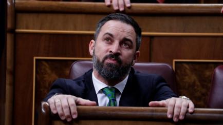 Leader of far right party Vox, Santiago Abascal takes his seat at the Spanish Parliament in Madrid, Spain, Sunday, Jan. 5, 2020. Spain's caretaker prime Minister Pedro Sanchez is not expected to clinch an absolute majority during a first round o...