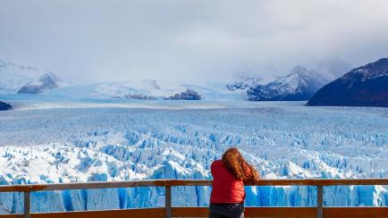 Tourist near the Perito Moreno Glacier, Argentina. Perito Moreno is a glacier located in the Los Glaciares National Park in the Argentinian Patagonia.
