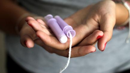 Close-Up Of Woman Hand Holding Tampons