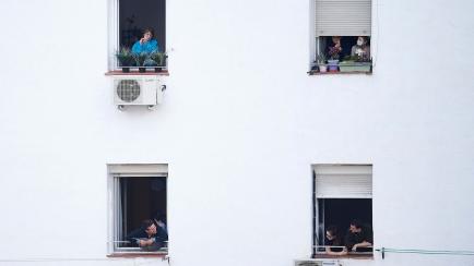 MADRID, SPAIN - MARCH 29: People applaud, from their windows, to show their gratitude to medical staff working on the front lines of the coronavirus outbreak as the country works to stop the spread of Covid-19 on March 29, 2020 in Various Cities...