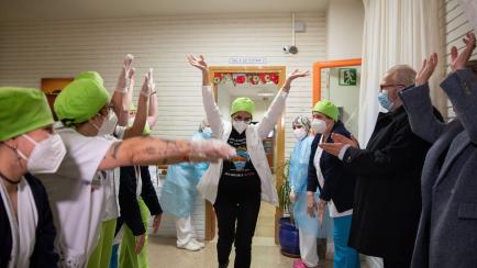 BARBASTRO, SPAIN - DECEMBER 27: In this handout photo, Maria Carmen CortÃ©s, 45, a nurse at the Somontano residence and several health workers celebrate moments after receiving one of the first Pfizer/BioNTech Covid-19 vaccines in Spain on Dec...