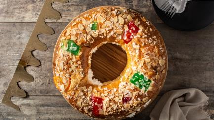 Epiphany cake "Roscon de Reyes" on wooden table