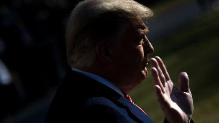 TOPSHOT - US President Donald Trump walks to Marine One on the South Lawn of the White House on January 12, 2021 in Washington,DC before his departure to Alamo, Texas. (Photo by Brendan Smialowski / AFP) (Photo by BRENDAN SMIALOWSKI/AFP via Gett...