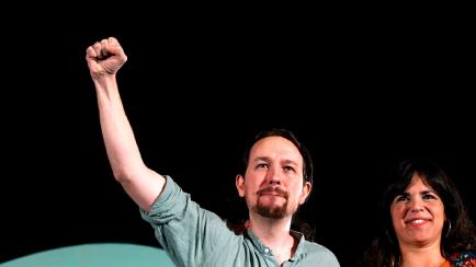 Spain's left-wing party Podemos leader Pablo Iglesias (L)
attends a 'Adelante Andalucia' (Podemos+IU) campaign rally to support his candidate for the upcoming regional elections in Andalusia, Teresa Rodriguez (R) in Seville on November 24, 2018....
