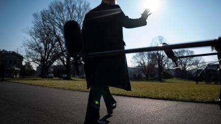 WASHINGTON, DC - JANUARY 12: President Donald J. Trump stops to talk to reporters as he walks to board Marine One and depart from the South Lawn at the White House on Tuesday, Jan 12, 2021 in Washington, DC. (Photo by Jabin Botsford/The Washingt...