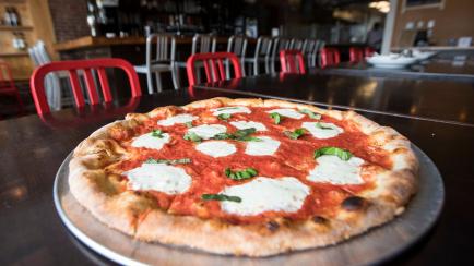 NEWTON, MA - MARCH 21: A Margherita pizza sits on a table at Stone L'Oven in Newton, MA on Mar. 21, 2017. (Photo by Keith Bedford/The Boston Globe via Getty Images)