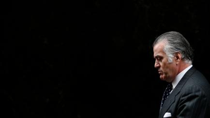 Former People's Party treasurer Luis Barcenas leaves Spain's High Court after appearing before a judge in Madrid March 22, 2013. Barcenas is charged with using his position as People's Party treasurer and senator to take bribes, evade taxes by h...