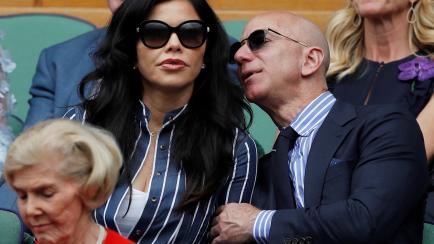Tennis - Wimbledon - All England Lawn Tennis and Croquet Club, London, Britain - July 14, 2019  Amazon CEO Jeff Bezos and his girlfriend TV presenter Lauren Sanchez in the Royal Box during the final between Switzerland's Roger Federer and Serbia...