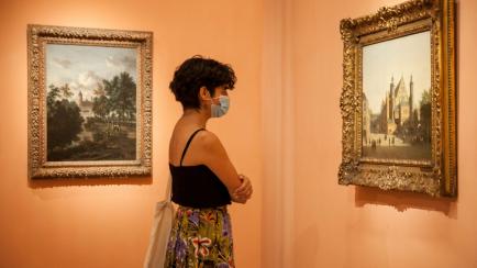 MADRID, SPAIN - JUNE 6: A woman wearing a face mask enjoys one of the exhibition rooms at Thyssen-Bornemisza National Museum on June 6, 2020, in Madrid, Spain. Today, the museum reopened to the public with reduced capacity and social distancing ...