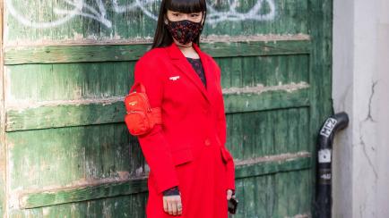 PARIS, FRANCE - FEBRUARY 25: Kozue Akimoto is seen wearing face mask, red coat outside Marine Serre during Paris Fashion Week - Womenswear Fall/Winter 2020/2021 : Day Two on February 25, 2020 in Paris, France. (Photo by Christian Vierig/Getty Images)