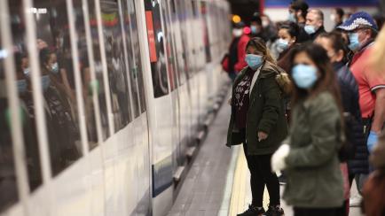 MADRID, SPAIN - MAY 04: Commuters with masks on a platform of Nuevos Ministerios metro station during phase 0 of the government de-escalation at the start of week 8 of the state of alarm decreed by the coronavirus and on the day it is the mandat...