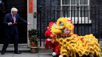 British Prime Minister Boris Johnson gestures as he watches a performance during celebrations for Chinese Lunar New Year at Downing Street in London, Britain January 24, 2020. REUTERS/Toby Melville     TPX IMAGES OF THE DAY