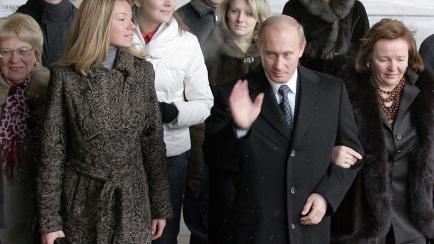 Putin junto a su exmujer y su hija Maria.