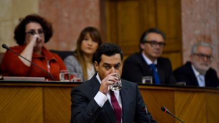 Leader of the conservative People's Party (PP) in Andalusia, Juanma Moreno Bonilla, drinks water during the second day debate on the investiture of a centre-right government forged with support of far-right at the Andalusian regional parliament ...