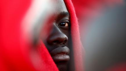 A migrant, intercepted off the coast in the Mediterranean Sea, waits to disembark from a rescue boat at the port of Malaga, southern Spain, January 6, 2019. REUTERS/Jon Nazca