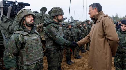 Spain's Prime minister Pedro Sanchez talks with soldiers during a visit of the Adazi military base, north east of Riga, Latvia, on March 8, 2022. (Photo by Toms Norde / AFP) (Photo by TOMS NORDE/AFP via Getty Images)