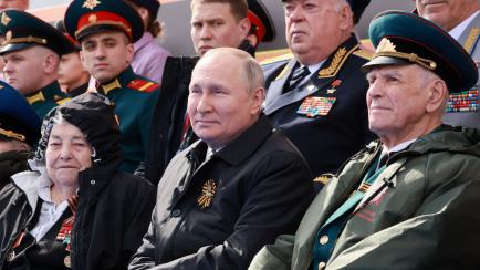 Russian President Vladimir Putin watches a military parade on Victory Day, which marks the 77th anniversary of the victory over Nazi Germany in World War Two, in Red Square in central Moscow, Russia May 9, 2022. Sputnik/Mikhail Metzel/Pool via R...