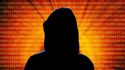 Silhouette portrait of a computer hacker