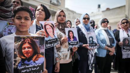 Members of the Palestinian Journalists Syndicate and the Council of Agents of the Orthodox Church in Gaza participate in a demonstration in Gaza City on May 15, 2022, inside the church headquarters in Gaza to protest the killing of Al-Jazeera jo...