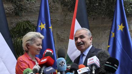 (R to L) Palestinian Prime Minister Mohammad Shtayyeh and the President of the European Commission Ursula von der Leyen give a joint press statement in the city of Ramallah in the occupied West Bank on June 14, 2022. (Photo by ABBAS MOMANI / AFP...