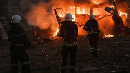 Firefighters work at the site of fire after Russian shelling in Mykolaiv, Ukraine, Saturday, June 18, 2022. (AP Photo/George Ivanchenko)