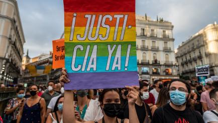 MADRID, SPAIN - 2021/09/11: A protester carrying a placard reading 'justice now' during a demonstration in Puerta del Sol against attacks to LGTBI people. Protests against homophobic aggressions are taking place in many cities of Spain. (Photo b...