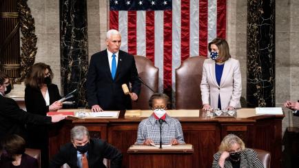 WASHINGTON, DC - JANUARY 06: Vice President Mike Pence and Speaker of the House Nancy Pelosi (D-CA) preside over a joint session of Congress on January 6, 2021 in Washington, DC. Congress has reconvened to ratify President-elect Joe Biden's 306-...