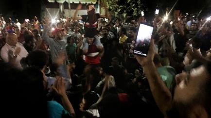 Protesters chant slogans against the regime in Cairo, Egypt, early Saturday, Sept. 21, 2019. Dozens of people held a rare protest in Cairo during which they called on Egyptian President Abdel-Fattah el-Sissi to quit. Security forces dispersed th...