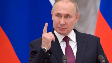 Russian President Vladimir Putin gestures as he speaks during a joint news conference with German Chancellor Olaf Scholz following their talks in the Kremlin in Moscow, Russia, Tuesday, Feb. 15, 2022. Putin said Moscow is ready for security talk...