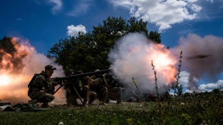 Ukrainian servicemen shoot with SPG-9 recoilless gun during training in Kharkiv region, Ukraine, Tuesday, July 19, 2022. (AP Photo/Evgeniy Maloletka)