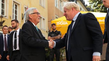 European Commission President Jean-Claude Juncker, left, shakes hands with British Prime Minister Boris Johnson prior to a meeting at a restaurant in Luxembourg, Monday, Sept. 16, 2019. British Prime Minister Boris Johnson was holding his first ...