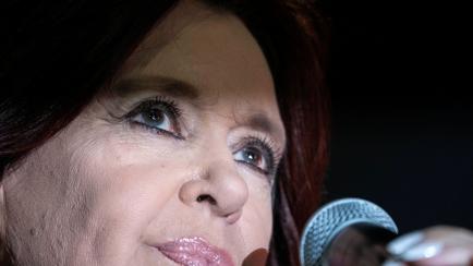 Cristina Fernandez, Argentina's former president and the country's current vice president, delivers a speech in front of her home in Buenos Aires, Argentina, Saturday, Aug. 27, 2022. People gathered to show their support after prosecutors have a...