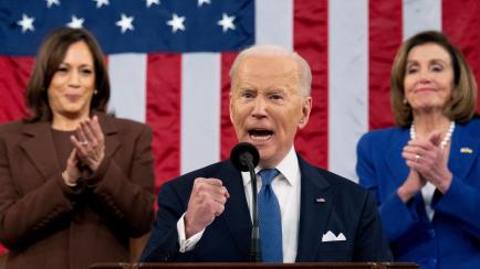 President Joe Biden delivers his first State of the Union address to a joint session of Congress at the Capitol, as Vice President Kamala Harris and House Speaker Nancy Pelosi of Calif., watch, Tuesday, March 1, 2022, in Washington. (Saul Loeb/P...