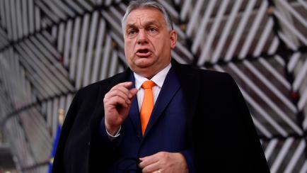 Hungary's Prime Minister Viktor Orban speaks as he arrives for an EU summit at the European Council building in Brussels, Thursday, Dec. 10, 2020. European Union leaders meet for a year-end summit that will address anything from climate, sanctio...